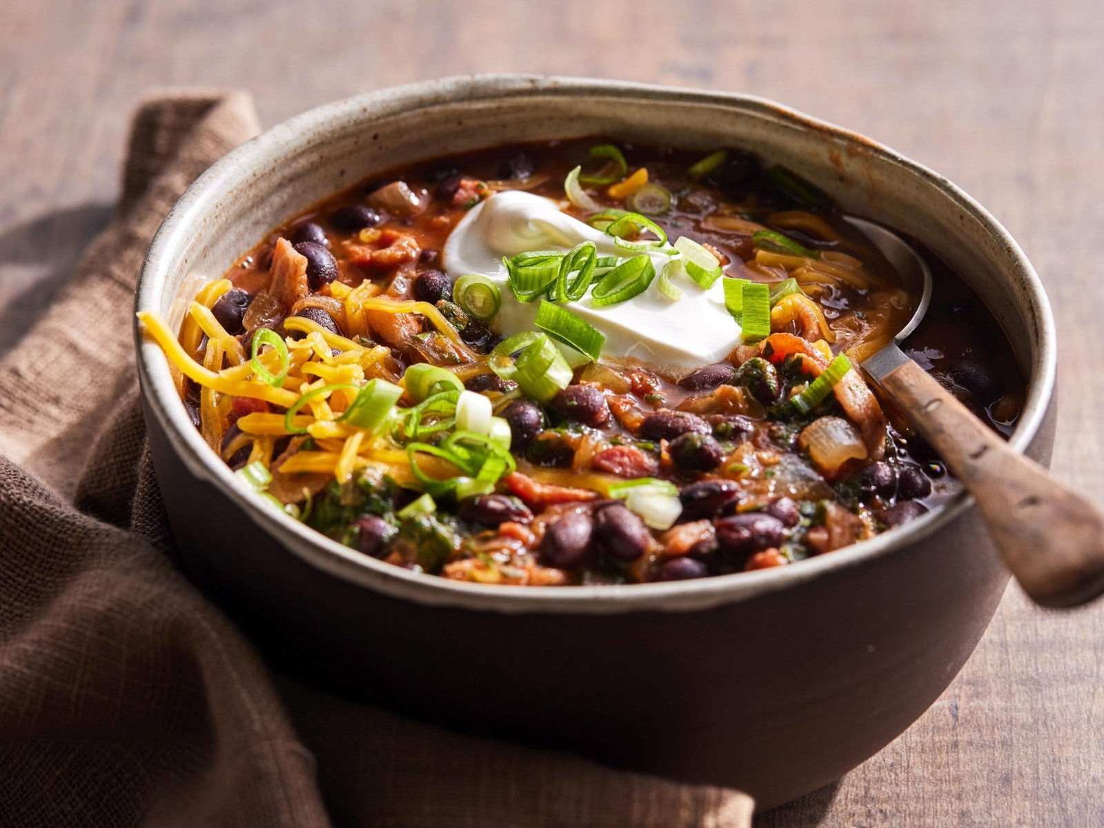 A bowl of freshly cooked black soybean stew, a traditional dish in Northeast Indian cuisine.