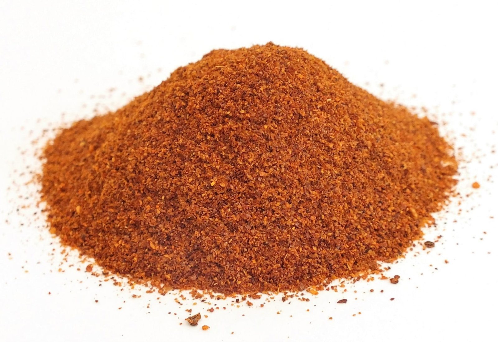 Variety of Bhut Jolokia-based products including hot sauce, chili powder, and medicinal oils.