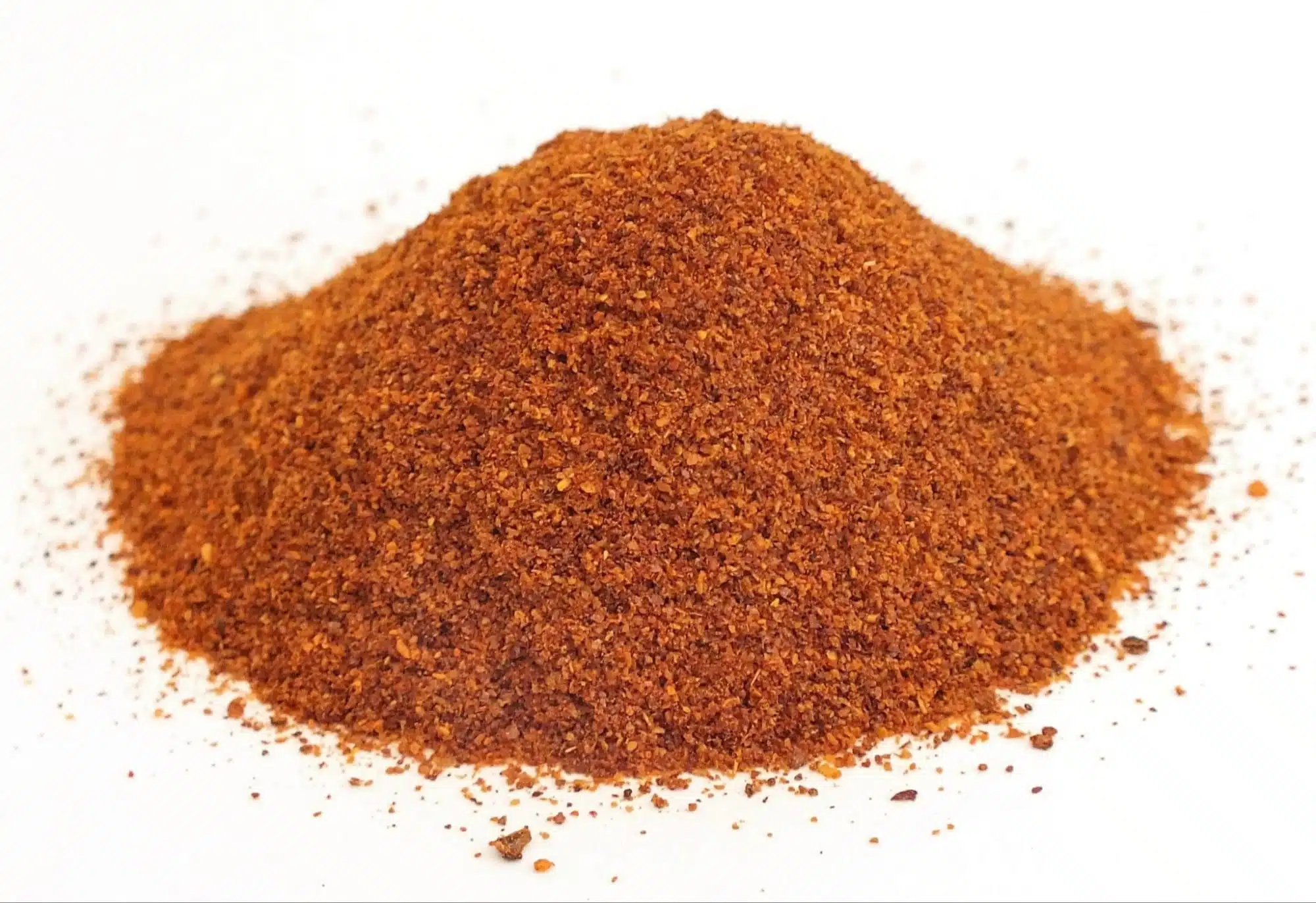 Variety of Bhut Jolokia-based products including hot sauce, chili powder, and medicinal oils.